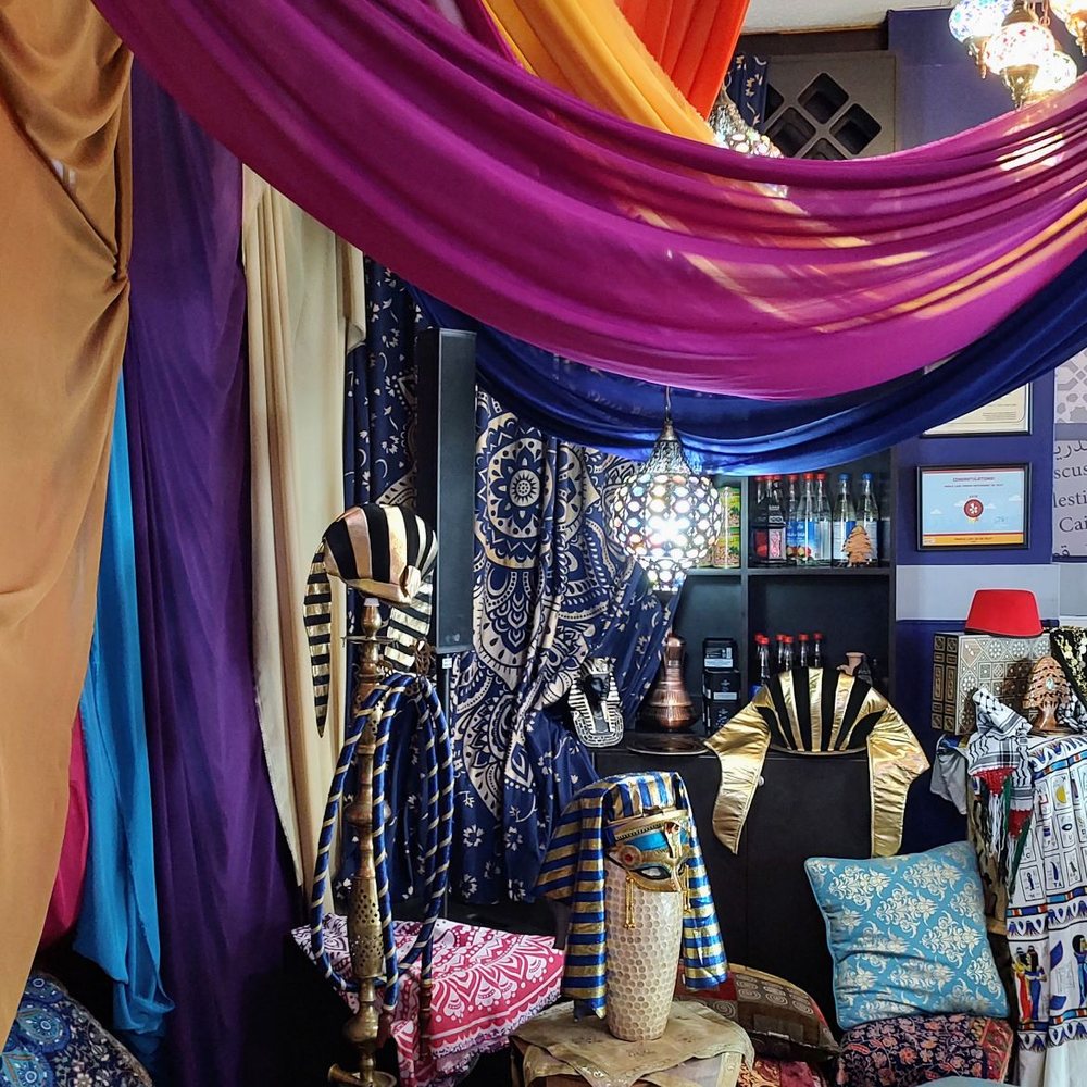 Faraon Restaurant - a room with a variety of fabrics hanging from the ceiling - Mediterranean Near Me - Miami, Florida Faraon Restaurant - a room with a variety of fabrics hanging from the ceiling - Mediterranean Near Me - Miami, Florida