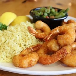 Our hand breaded wild caught Texas Gulf shrimp is fried to crispy, golden perfection and served with two made from scratch hu...