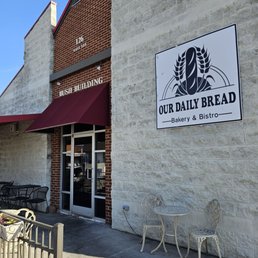 Exterior outside entrance of Our Daily Bread Bakery & Bistro - The restaurant sign, the main entrance, and the outside seating area. - Vinton, Virginia Exterior outside entrance of Our Daily Bread Bakery & Bistro - The restaurant sign, the main entrance, and the outside seating area. - Vinton, Virginia