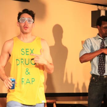 Bye Bye Liver - a man in a yellow shirt and a man in a blue shirt - Comedy Clubs Near Me - Philadelphia, Pennsylvania