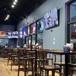Touchdown Sports Bar and Lounge - Bar seating, high bar table seating and booth seating that can very easily accommodate 6 adults