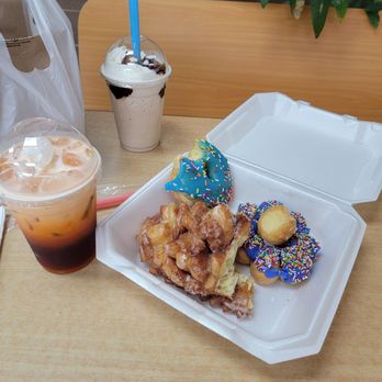 Dev's Donuts - Pine cone donut, mochi donut, Thai milk tea, mocha frappe, blue iced donut with sprinkles, and extra donut holes - Donuts Near Me - Marietta, Georgia Dev's Donuts - Pine cone donut, mochi donut, Thai milk tea, mocha frappe, blue iced donut with sprinkles, and extra donut holes - Donuts Near Me - Marietta, Georgia
