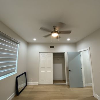 Andy Bong Floors - an empty room with a ceiling fan - Flooring Near Me Andy Bong Floors - an empty room with a ceiling fan - Flooring Near Me