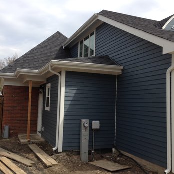 Easy Construction - a blue house with white trim - General Contractors Near Me Easy Construction - a blue house with white trim - General Contractors Near Me