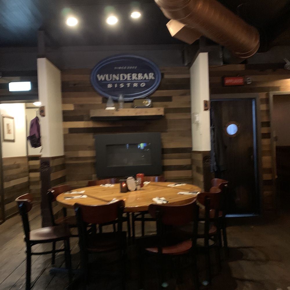 Wunderbar Bistro - Unlit fireplace in dining area. - American Near Me - Hudson, New York Wunderbar Bistro - Unlit fireplace in dining area. - American Near Me - Hudson, New York