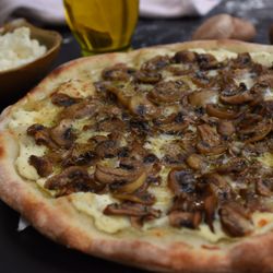 Funghi Al Tartufo: All Natural Ricotta Sauce, Mushrooms, All Natural Parmesan, All Natural Mozzarella, Oregano & Italian Truffle Oil.