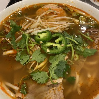 Le Mekong - Spicy Beef Pho - thick rice noodles in spicy lemongrass broth with sliced beef and Vietnamese pork ham - Vietnamese Near Me - Johns Creek, Georgia Le Mekong - Spicy Beef Pho - thick rice noodles in spicy lemongrass broth with sliced beef and Vietnamese pork ham - Vietnamese Near Me - Johns Creek, Georgia