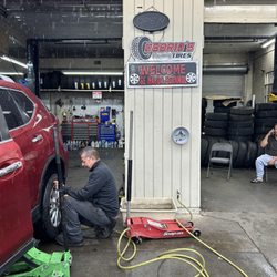 Osorio’s Tires - Salvador patching my tire in the rain!