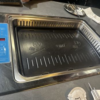 Dae Gee Korean Bbq - Our clean grill. Clearly a before shot. Because it was tore up by the time we were done. - Barbeque Near Me - Castle Rock, Colorado Dae Gee Korean Bbq - Our clean grill. Clearly a before shot. Because it was tore up by the time we were done. - Barbeque Near Me - Castle Rock, Colorado