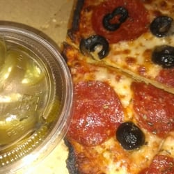 Domino's Pizza - Medium thin crust (don't like a lot of dough) pepperoni and black olive pizza with a side of jalapenos ....