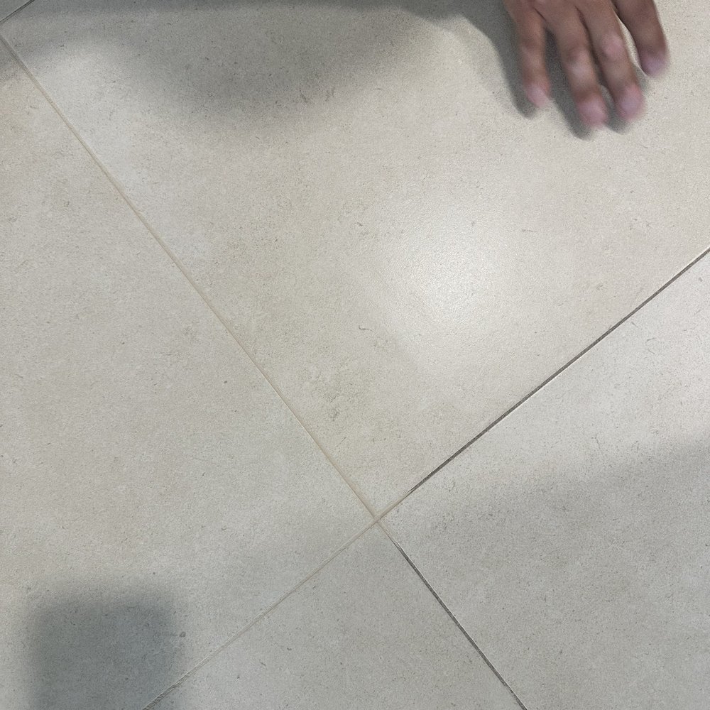 Recolored grout (top left) vs the existing color (bottom right)--grout cleaning Recolored grout (top left) vs the existing color (bottom right)--grout cleaning