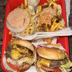 In-N-Out Burger - My order was messed up. Missing a whole burger patty on the bottom right and giant whole raw onion on fries top left