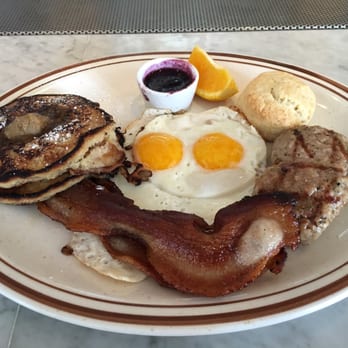 Salt's Cure - All-star breakfast, biscuit and jam, orange slice, sausages, sunny side up eggs, bacon, griddle cakes with brown sugar sauce - Breakfast & Brunch Near Me - Los Angeles, California Salt's Cure - All-star breakfast, biscuit and jam, orange slice, sausages, sunny side up eggs, bacon, griddle cakes with brown sugar sauce - Breakfast & Brunch Near Me - Los Angeles, California