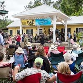 BuskerStuff - a crowd of people sitting in lawn chairs - Music Venues Near Me - Zachary, Louisiana
