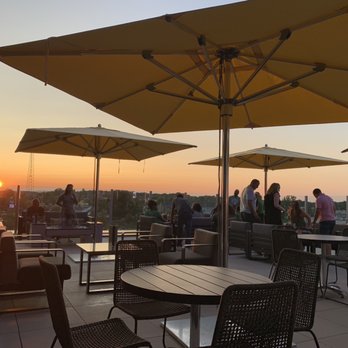 Topgolf - Balcony sunset - New American Near Me - Greenville, South Carolina Topgolf - Balcony sunset - New American Near Me - Greenville, South Carolina