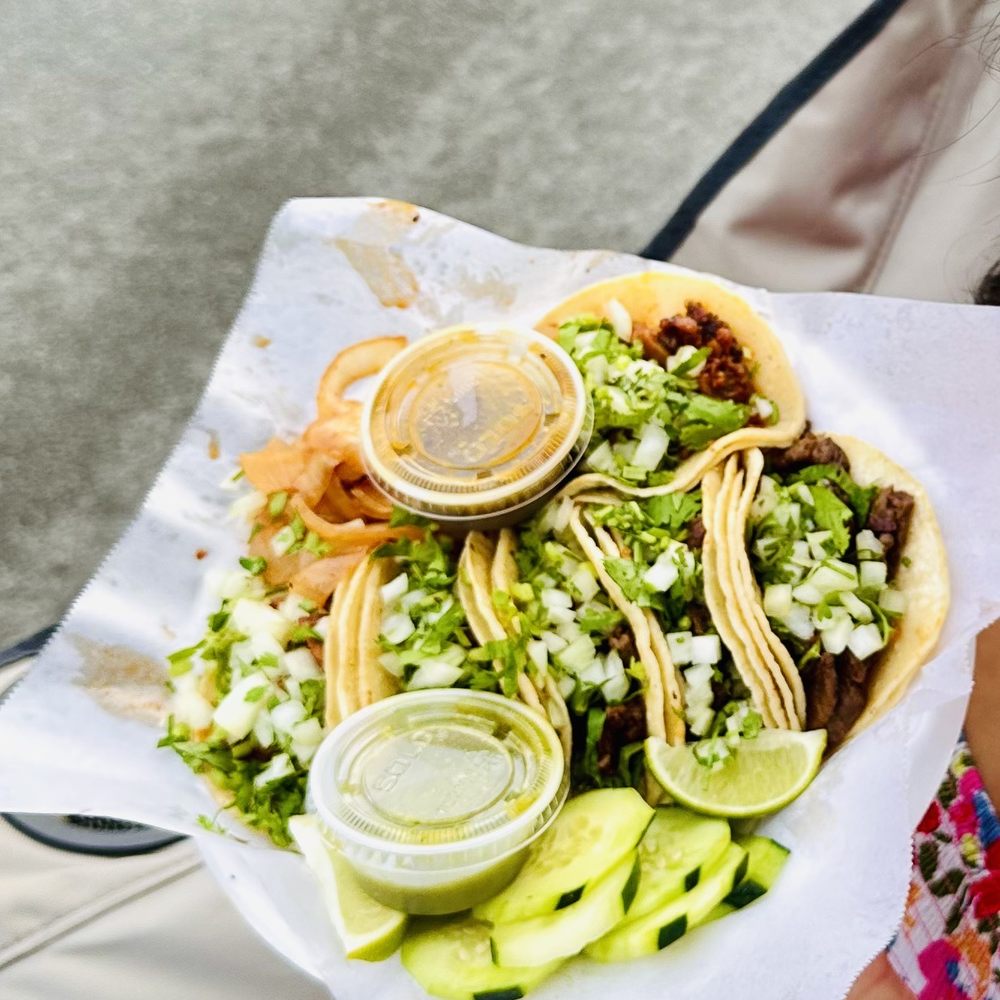 Tacos El Chino - a person holding a plate of food - Tacos Near Me - Reno, Nevada Tacos El Chino - a person holding a plate of food - Tacos Near Me - Reno, Nevada