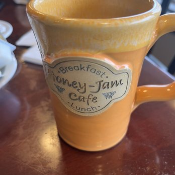 Honey-Jam Cafe - a coffee mug on a table - Breakfast & Brunch Near Me - Countryside, Illinois Honey-Jam Cafe - a coffee mug on a table - Breakfast & Brunch Near Me - Countryside, Illinois