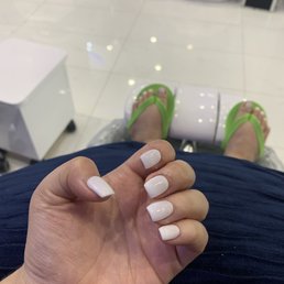 Acrylic white nails & White toe pedicure. Acrylic white nails & White toe pedicure.