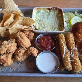 BJ's Restaurant & Brewhouse - Brewhouse bites sampler. With spinach artichoke dip, boneless lemon pepper wings - Pizza Near Me - New Braunfels, Texas BJ's Restaurant & Brewhouse - Brewhouse bites sampler. With spinach artichoke dip, boneless lemon pepper wings - Pizza Near Me - New Braunfels, Texas
