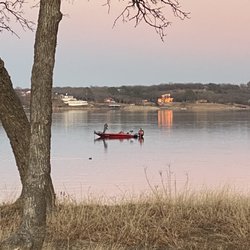 Lake Nocona - Ducks roll by boats & illuminated pink houses on Lake Nocona.