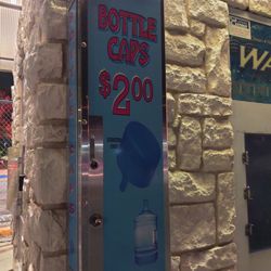 Agua Purificada - Bottle caps. Only takes quarters.