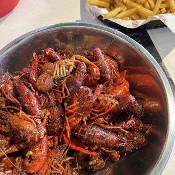 Crawfish Cafe - Garlic butter, Cajun seasoning and Thai basil flavor  Cajun Fries - Seafood Near Me - Houston, Texas