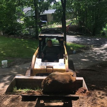 Breault Construction - a bulldozer in the back yard - Excavation Services Near Me