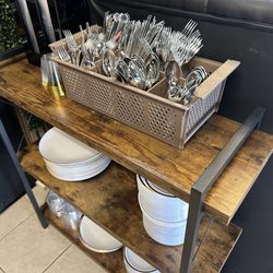Bombay Bistro - Plastic plates and utensils next to the buffet.