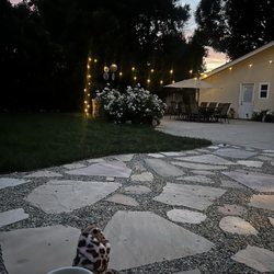 Alvare'z Tree service - My beautifully landscaped backyard. He did the flagstone and grass and concrete and the lights and the light pole!! Incredible!!!!!!