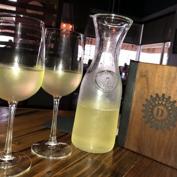 District Kitchen & Cocktails - Pineapple mimosa - New American Near Me - Austin, Texas District Kitchen & Cocktails - Pineapple mimosa - New American Near Me - Austin, Texas