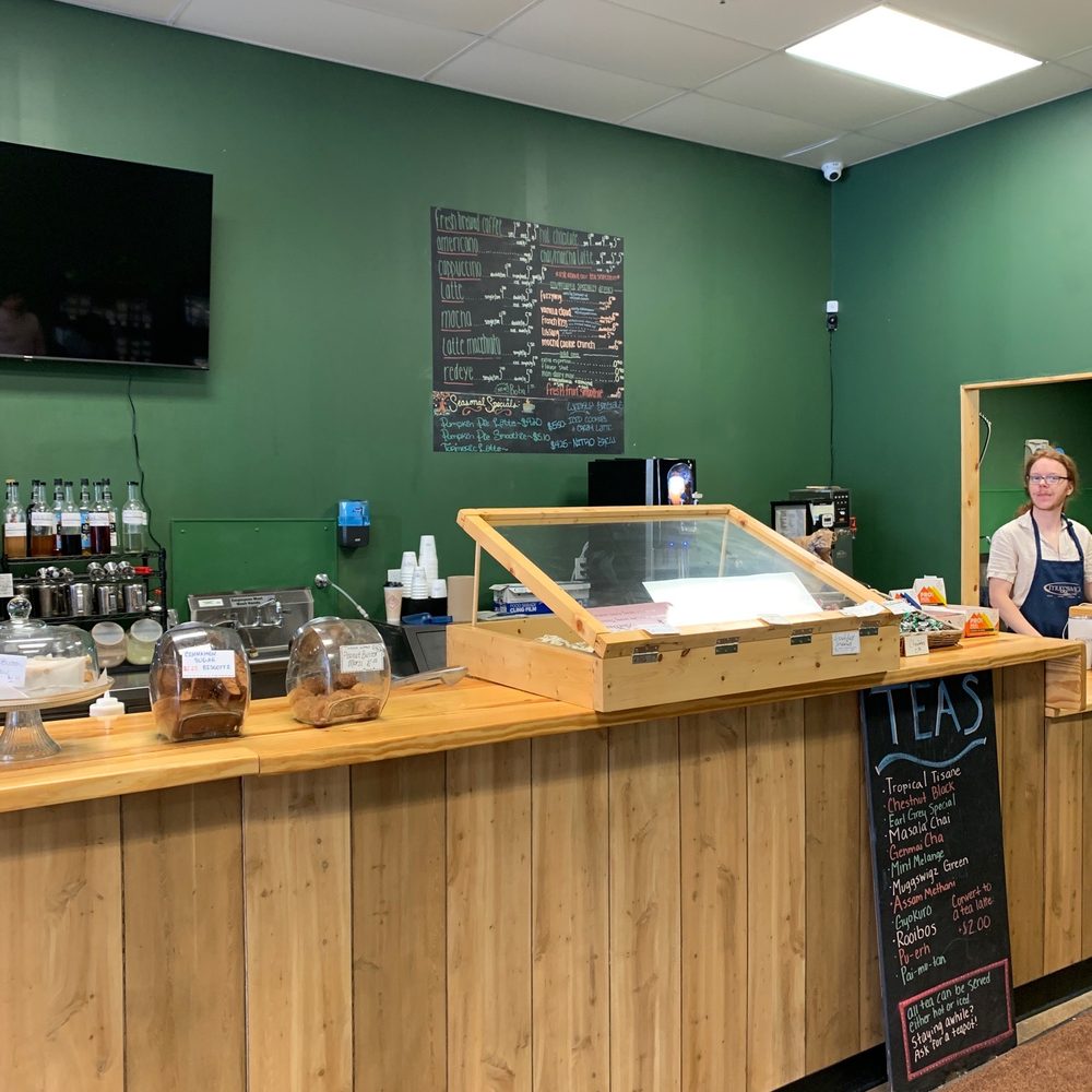 a woman behind the counter a woman behind the counter