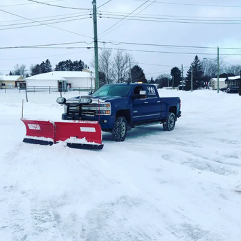 Your Yard Necessities - a snow plow in the snow - Snow Removal Near Me Your Yard Necessities - a snow plow in the snow - Snow Removal Near Me