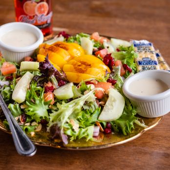 Lost In Time - a plate of salad with dressing - Specialty Food Near Me - Fairbury, Illinois