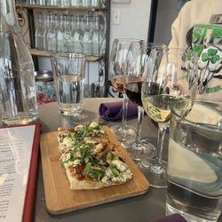 Flights Wine Cafe - Happy hour wine flight and Fig & arugala flatbread