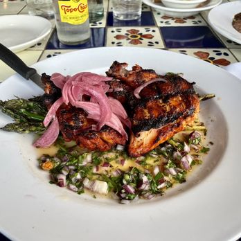Nuestra Cocina - Pollo asado en achiote salpicon; grilled half chicken, habenero salsa and grilled asparagus - Mexican Near Me - Portland, Oregon