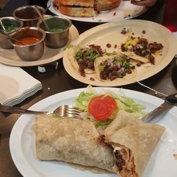 Los Carboncitos - Non smothered burrito in the front. Some tacos on the middle. Right next to them are the salsas. And to the back is a torta. - Tacos Near Me - Denver, Colorado Los Carboncitos - Non smothered burrito in the front. Some tacos on the middle. Right next to them are the salsas. And to the back is a torta. - Tacos Near Me - Denver, Colorado