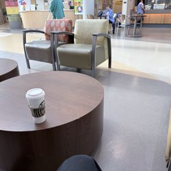 Large dark roast hot coffee and seating area
