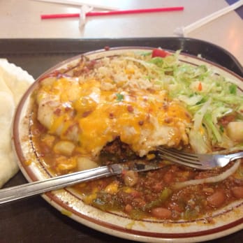 Frontier - Frontier burrito- plastic cheese, bag lettuce, unseasoned rice + stew that looks like it was from a can with uncooked beef added - Mexican Near Me - Albuquerque, New Mexico Frontier - Frontier burrito- plastic cheese, bag lettuce, unseasoned rice + stew that looks like it was from a can with uncooked beef added - Mexican Near Me - Albuquerque, New Mexico