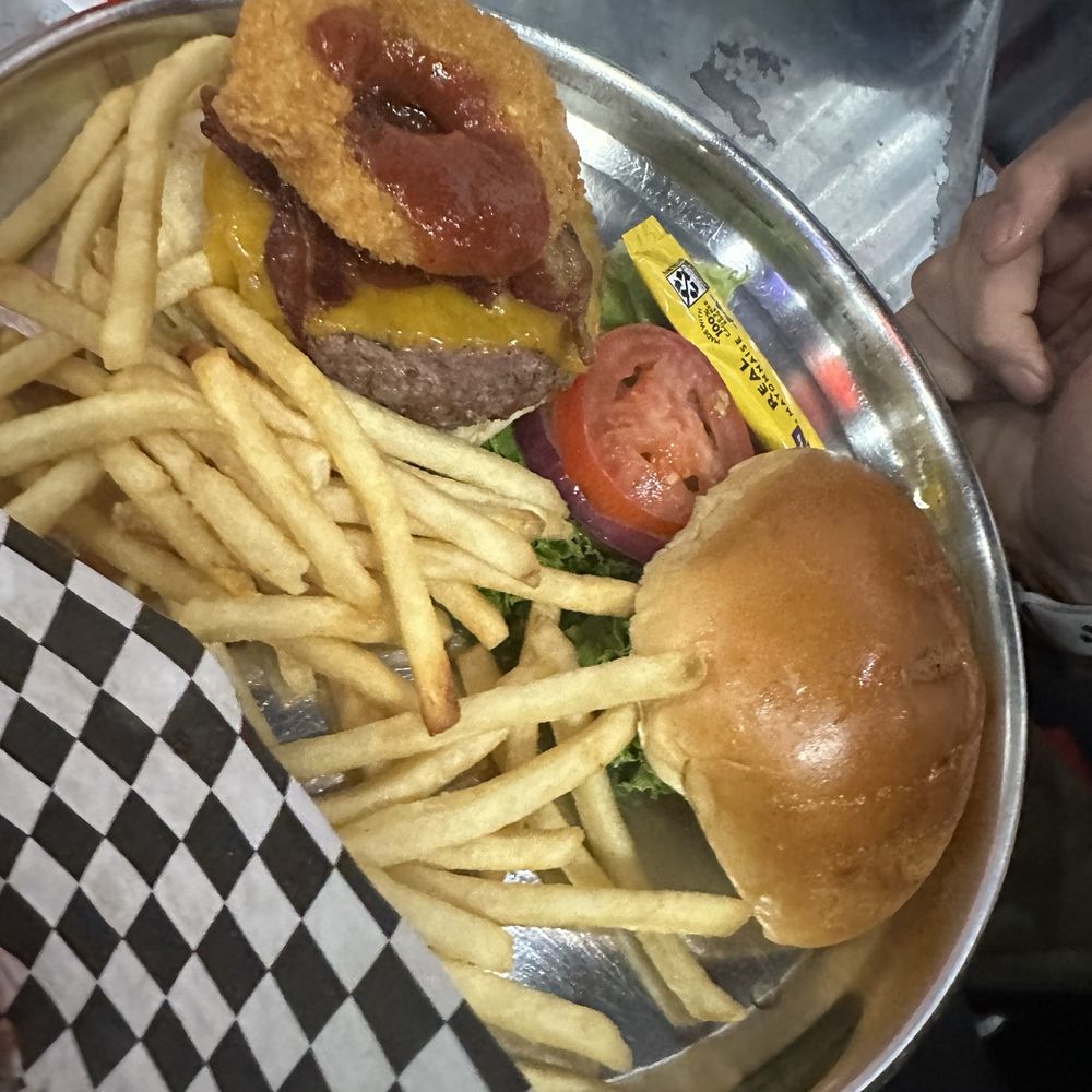 Cruiser's Cafe 66 - Burger meal. Forgot the name. Had onion ring and bacon on it. Was a good burger. - American Near Me - Williams, Arizona Cruiser's Cafe 66 - Burger meal. Forgot the name. Had onion ring and bacon on it. Was a good burger. - American Near Me - Williams, Arizona