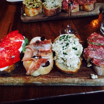 Postino East - From left to right: 1) tomato, basil, mozzarella  2) prosciutto, fig, cheese 3) artichoke spread 4) salami and pesto - Wine Bars Near Me - Gilbert, Arizona