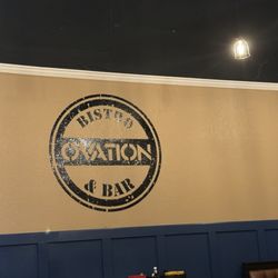 Ovation Bistro & Bar - Sign on back wall.