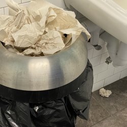 Greco Fresh Grille - Overflowing trash in bathroom