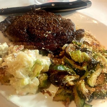 Del Frisco's Double Eagle Steakhouse - Prime Ribeye with Brussels sprouts & potatoes. - Steakhouses Near Me - Dallas, Texas