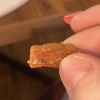 Denny's - a hand holding a piece of food - American Near Me - Leominster, Massachusetts Denny's - a hand holding a piece of food - American Near Me - Leominster, Massachusetts