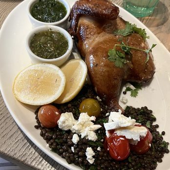 The Daisy Restaurant - SMOKED HALF CHICKEN black lentil-feta-tomato salad, green zhoug sauce and a tomatillo sauce - Farmers Market Near Me - Santa Barbara, California