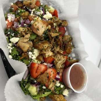 The Squeeze Station - a salad in a basket with dressing - Juice Bars & Smoothies Near Me - Detroit, Michigan The Squeeze Station - a salad in a basket with dressing - Juice Bars & Smoothies Near Me - Detroit, Michigan