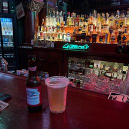 a beer and a beverage on a bar