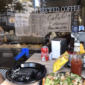 Lombardy Inn - Cell phone sitting on the cutting board where they prepare food / sandwiches - Hotels Near Me - Miami Beach, Florida