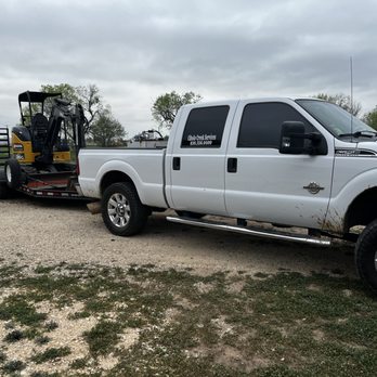 Cibolo Creek Services - a white truck with a forklift in the back - Dumpster Rental Near Me Cibolo Creek Services - a white truck with a forklift in the back - Dumpster Rental Near Me