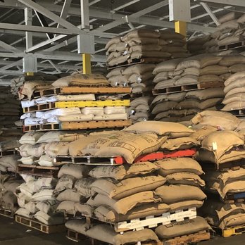 Doing Work Coffee - stacks of bags of coffee beans - Coffee Roasteries Near Me - Key West, Florida